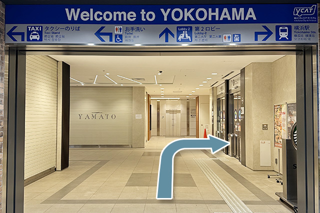 1.From YCAT Lobby 1, exit through the automatic door on the right as indicated by the arrow.