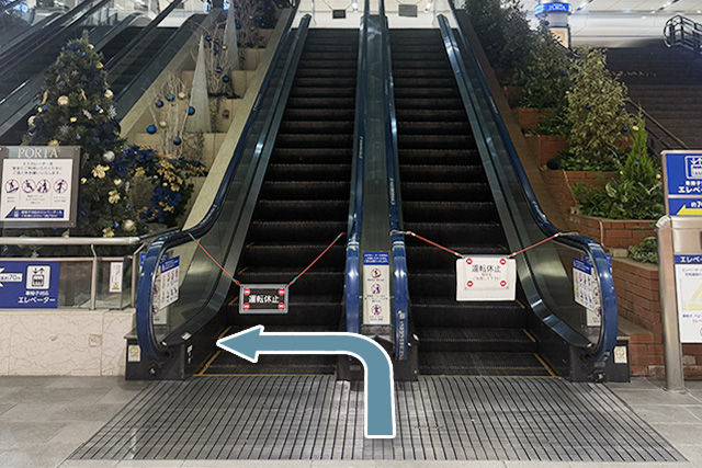 7.Turn left in front of the escalator.